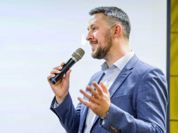 man is speaking into a microphone, speach